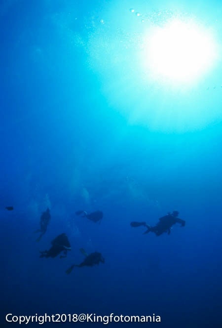 Deep water sunlight and divers Koh Bon